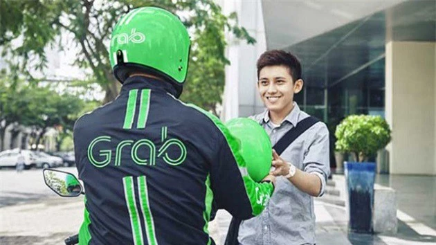 Người Việt ngày càng lựa chọn đặt xe qua ứng dụng Grab (Ảnh: TL)