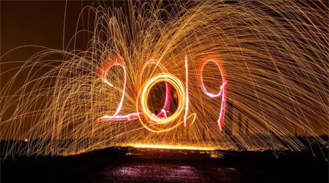 019 might be a few days away but celebrations have already begun. Lets look at how people are welcoming the New Year all across the world. (Pictured) A man draws 2019 with a torch as a man behind him spins with a slingshot with burning steel wool. The flying sparks contrast against the night sky on Dec. 27 in Berlin, Germany.