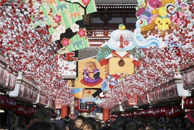 Tokyo, Japan People walk under decorations for new year through the alley leading to Asakusa Sensoji Buddhist temple in Tokyo, Japan, on Dec. 27.