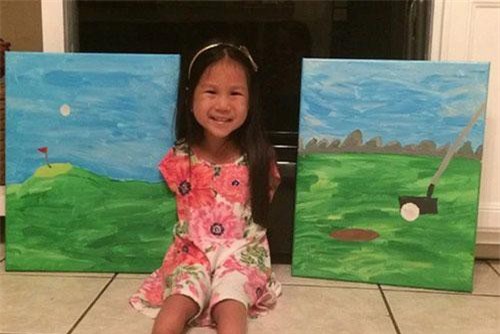 Em bé gốc Việt vẽ tranh bằng chân