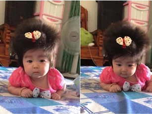 Cô nhóc 3 tháng tuổi có mái tóc dày và xù bông như trẻ 2 - 3 tuổi khiến nhiều người ngỡ ngàng