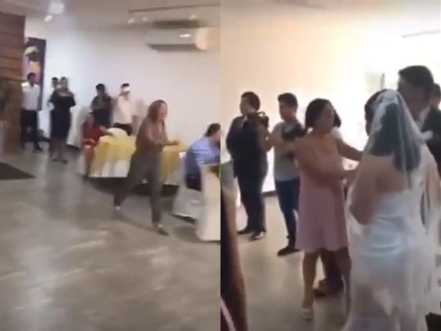 Cô gái xông vào đám cưới làm loạn và đánh cô dâu.