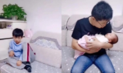 Thấy bố mải bế em gái mới sinh rồi "bỏ quên" mình, cậu bé có phản ứng khiến ai cũng bật cười