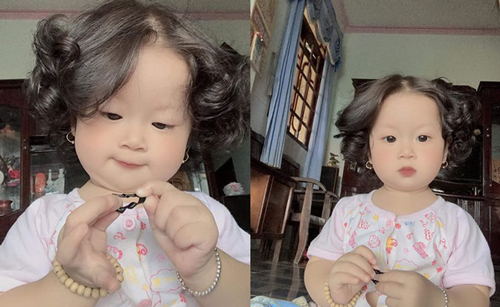 Xuất hiện bé gái có mái tóc xoăn "bà thím" nhưng đáng yêu hết nấc khiến dân mạng "tan chảy"