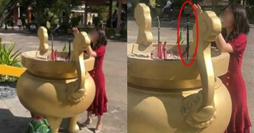 Cô gái bất chấp, cắm gậy chụp ảnh vào lư hương ở chùa để "sống ảo"