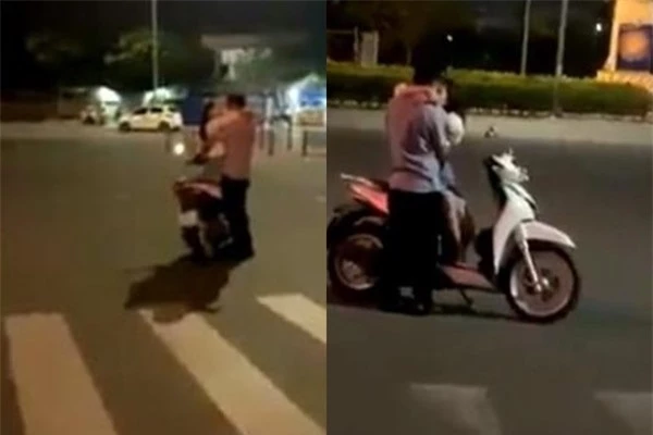 Cặp đôi dừng xe giữa đường rồi ôm hôn nhau.