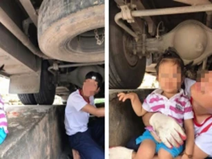 Mẹ khoe ảnh 2 bố con ngồi gầm ô tô: Người khen gia đình hạnh phúc, người lại chê nguy hiểm