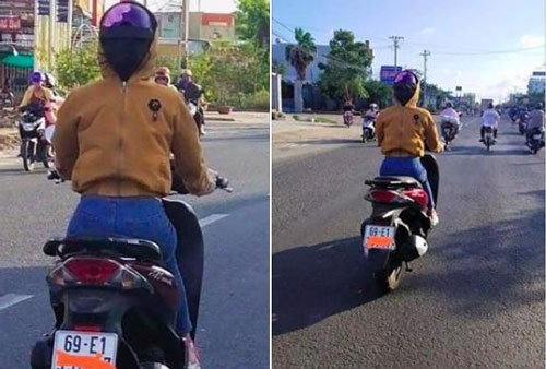 Cô gái lái xe băng băng trên đường nhưng lại mặc áo ngược, đội mũ bảo hiểm theo cách lạ lùng