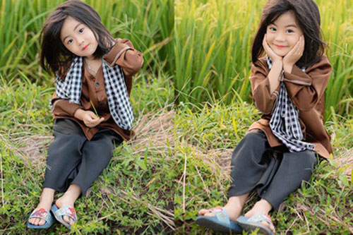 Bé gái xinh như thiên thần trên cánh đồng mùa lúa trổ bông