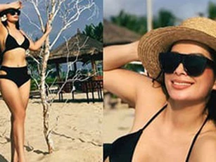 Thúy Hằng “khoe dáng” trên biển, tiết lộ “5 năm qua không dám diện bikini”