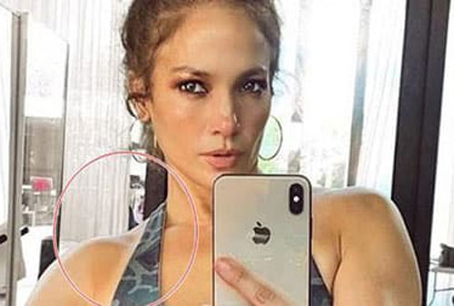 Jennifer Lopez khoe ảnh body, nhưng điều khiến fan hoảng sợ là người đàn ông bí ẩn sau lưng