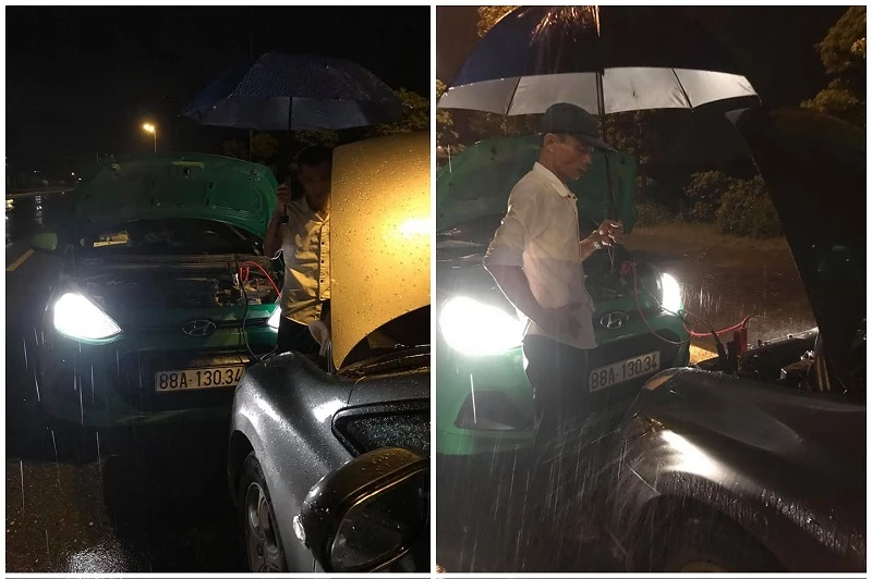Hình ảnh lái xe Nguyễn Thành Tuyên đấu sạc ắc quy giúp ô tô của Hoa Vũ trong cơn mưa tầm tã.