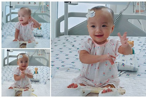 Cặp sinh đôi Trúc Nhi - Diệu Nhi dần hồi phục, ngồi bóc quà của 'fan', lắc lư theo điệu nhạc Baby Shark