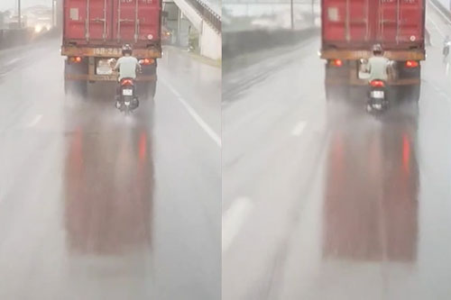 Người đàn ông 'chơi liều', bám đuôi container để trú mưa