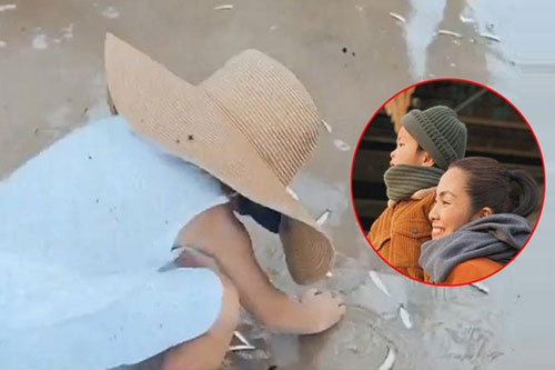 Con trai Tăng Thanh Hà nhặt cá phụ ngư dân