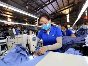 Đức hỗ trợ công nhân dệt may Việt Nam vượt COVID-19