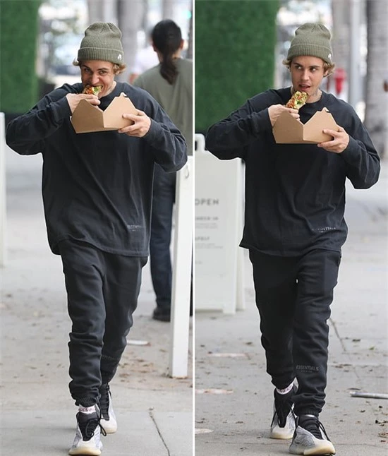 Dù dịch bệnh ở Los Angeles vẫn chưa hết và người dân phải đeo khẩu trang ra đường, Justin không ngần ngại ăn pizza trước khi lên xe.