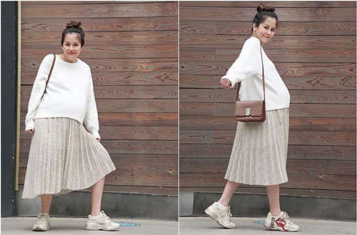 An Nguy bụng bầu xuống phố