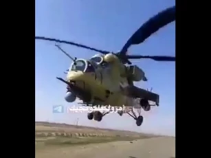 Trực thăng tấn công Mi-35 suýt lao vào xe tải quân sự