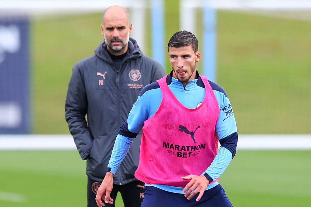 HLV Pep Guardiola và Ruben Dias.