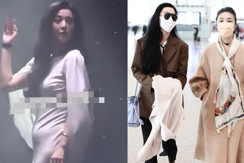 Phạm Băng Băng đeo thắt lưng nhưng tay vẫn ôm áo che bụng khi xuất hiện ở sân bay sau nghi vấn bầu bí