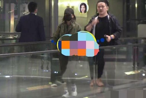 Triệu Vy bị chụp ảnh hút thuốc lá phì phèo, đứng đợi một người đàn ông đến đón