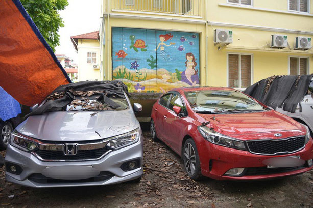 Ai chịu trách nhiệm bồi thường vụ bức tường đổ sập đè trúng 12 ô tô?