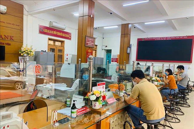 Ngân hàng Agribank huyện Văn Yên (Yên Bái) đã nhanh chóng triển khai nhiều chương trình, giải pháp hỗ trợ tài chính cho các doanh nghiệp bị ảnh hưởng bởi dịch bệnh COVID-19. Ảnh: Hải Quân/TTXVN