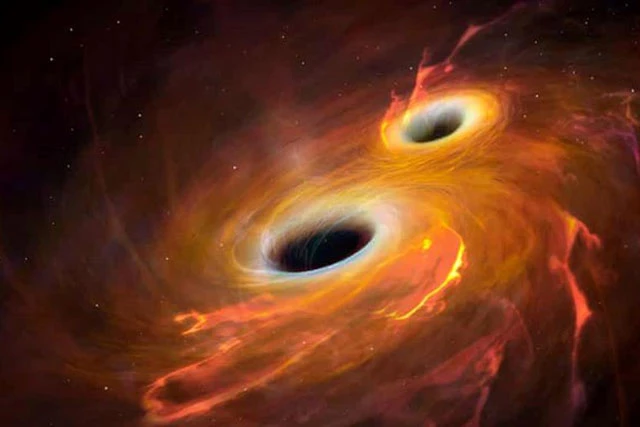 Hình minh họa hai hố đen quay xung quanh nhau. Ảnh The Guardian.