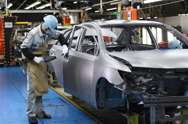 Công nhân làm việc tại nhà máy sản xuất ôtô ở tỉnh Aichi, Nhật Bản. (Ảnh: AFP/TTXVN)