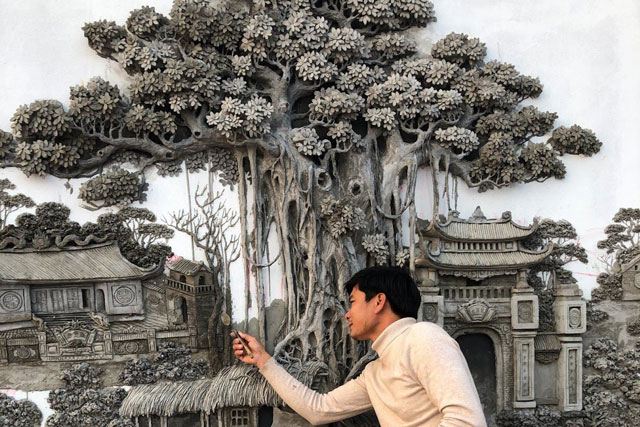 Từ cát và xi măng, chàng họa sĩ làm nên tuyệt tác trên bức tường khiến dân mạng trầm trồ