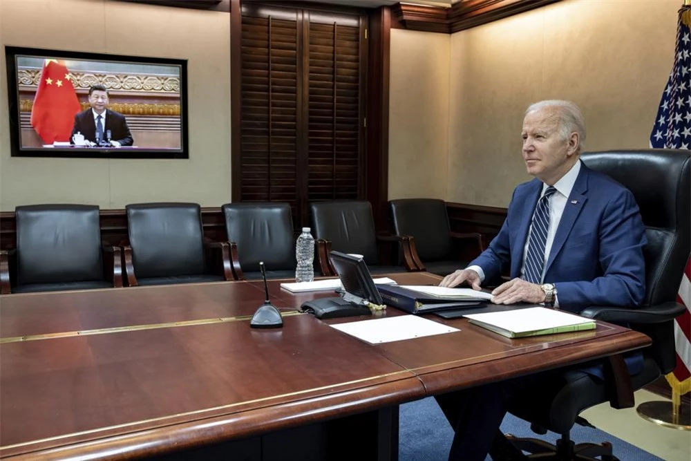 In this image provided by the White House, President Joe Biden meets virtually from the Situation Room at the White House with China’s Xi Jinping, Friday, March 18, 2022, in Washington. (The White House via AP)