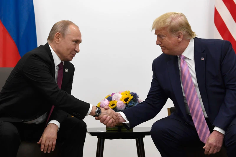 Tổng thống Putin và ông Trump (phải). Ảnh: Reuters.
