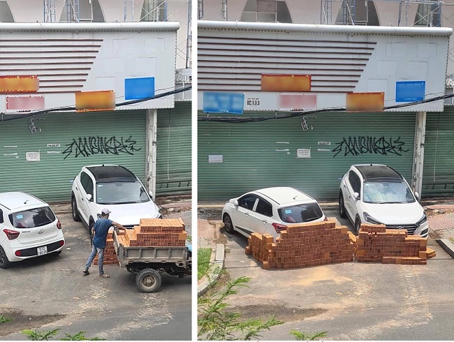 Người đàn ông dùng xe chở gạch, xếp thành hàng chặn đứng 2 ô tô đỗ trước cửa nhà