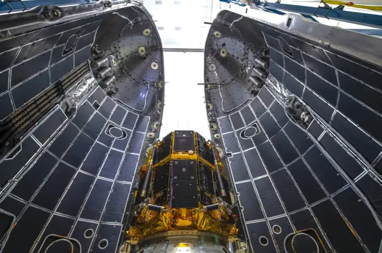 The ispace lunar lander inside the fairing of a SpaceX Falcon 9 rocket.