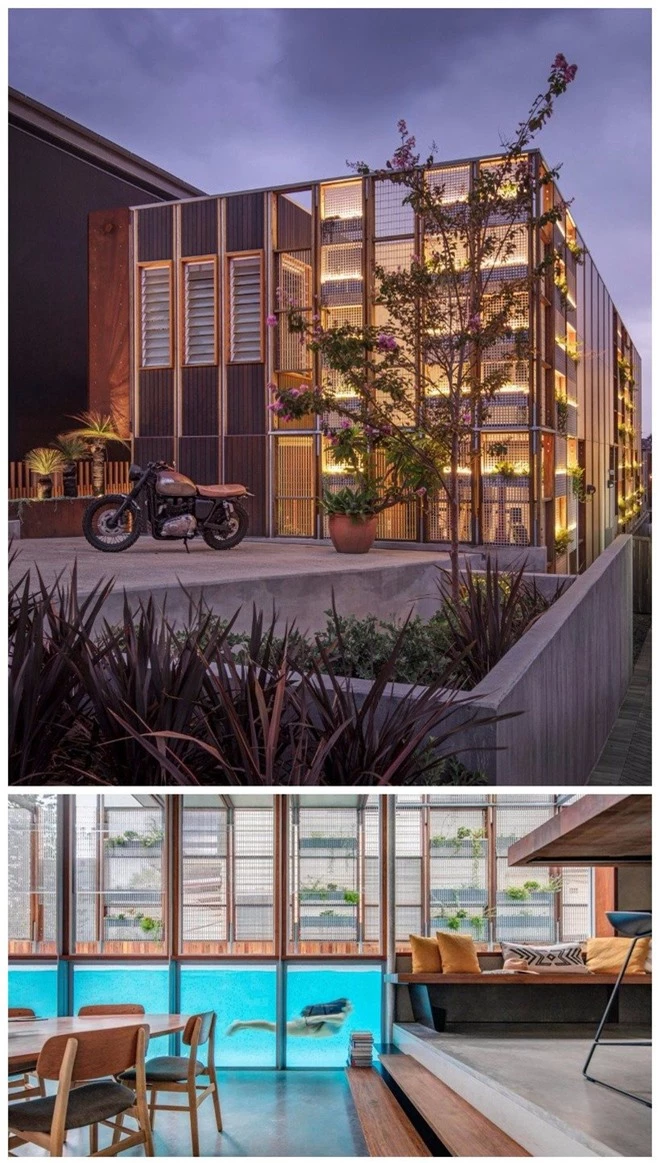  Công trình kiến trúc tại Sydney được thiết kế khá đơn giản với những gam màu trầm và các ô cửa trang trí bằng cây cối. Tuy nhiên điểm nhấn ở đây chính là một bể bơi chạy xuyên suốt qua trung tâm của ngôi nhà, thật đặc biệt phải không? 