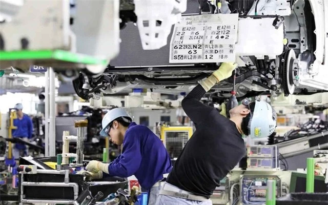 Kinh tế Nhật Bản tăng trưởng dương trở lại - Ảnh 1.