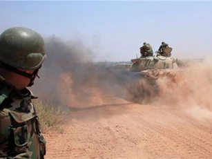 Phớt lờ liên quân Mỹ, quân đội Syria đẩy mạnh tấn công IS ở Raqqa