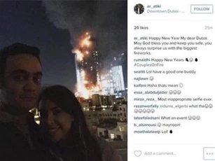 Cặp đôi bị ném đá vì chụp ảnh 'tự sướng' bên khách sạn cháy rụi ở Dubai
