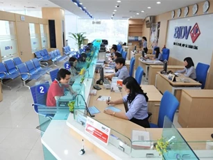 Bộ Tài chính trần tình việc “đòi” ngân hàng trả cổ tức bằng tiền