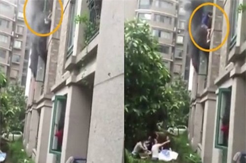 Thót tim chứng kiến ông bố ném con từ tầng 3 căn nhà bốc cháy