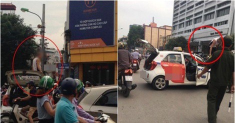 Bị CSGT Hà Nội dừng xe, tài xế taxi leo lên nóc xe "ăn vạ"