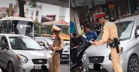 Hà Nội: Nữ tài xế cố thủ trên ôtô khi bị CSGT dừng xe